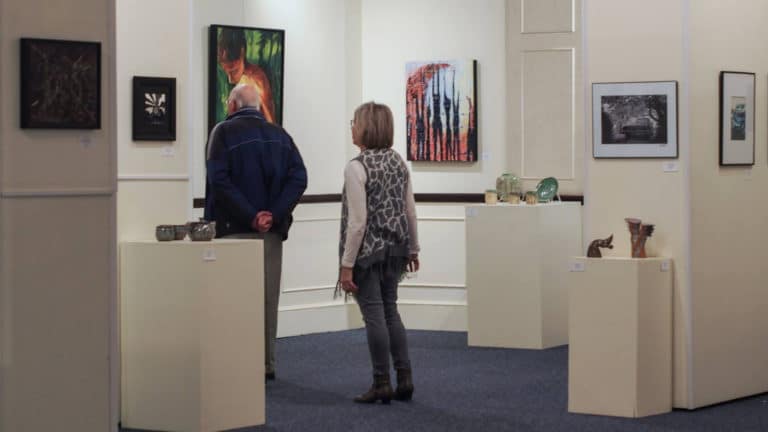 patrons viewing art in the Solomon Gallery